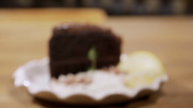 Chocolate cake with lemon slices on a plate