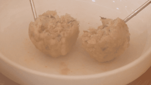 Steaming hot rolled dumplings that tear with chopsticks
