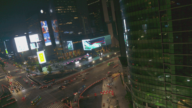 Night view of a bustling city intersection