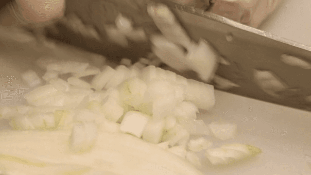 Chopping onions on a cutting board