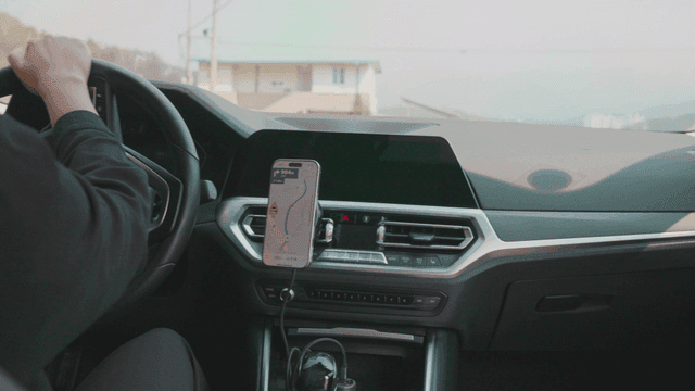 Woman driving while using a navigation app