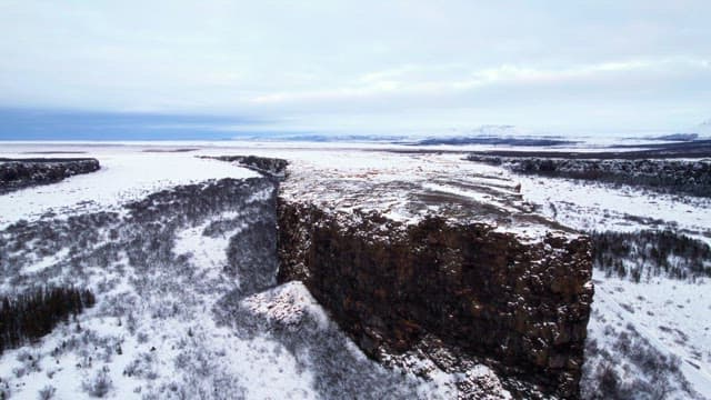 Snow-covered cliffs and vast landscape