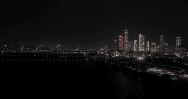 Night view of a city skyline with lights