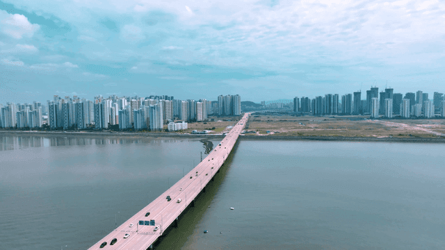 Bridge leading to modern city skyline