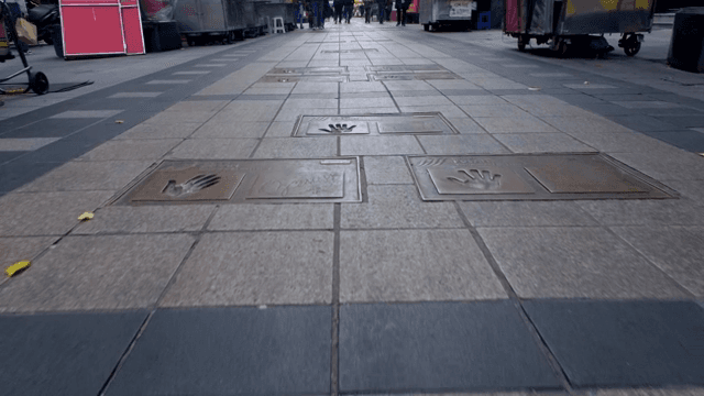 Street with handprints and festival stalls