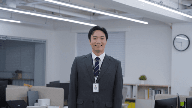 An office worker smiling in an office