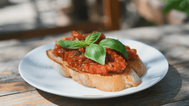 Bruschetta with tomato and basil on a plate