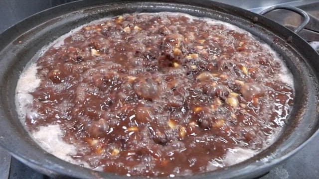 Chestnuts and red beans boiling in a large pot