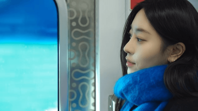 Woman gazing out a train window