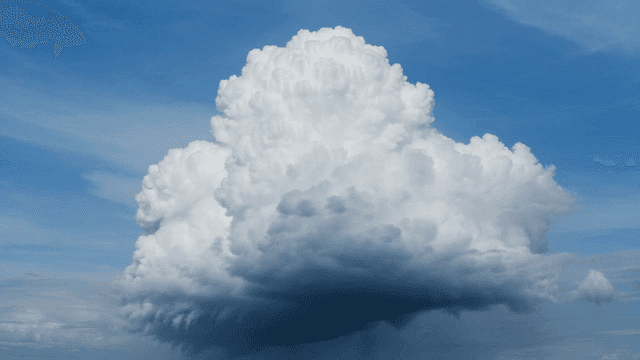 Large cumulus clouds in blue sky