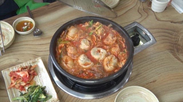 Boiling Dumplings in Spicy Broth