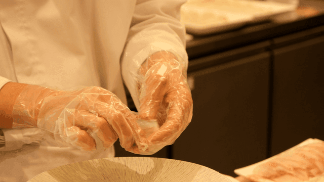 Chef preparing sushi with precision