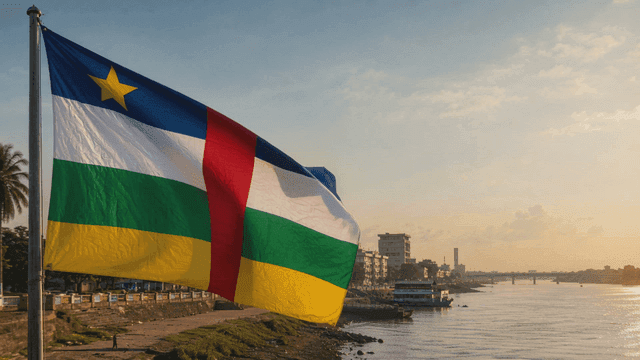 Central African Republic flag fluttering at sunset by river