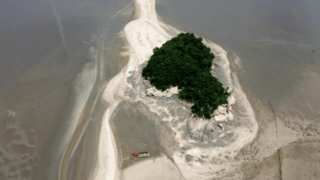 Small island surrounded by mudflats