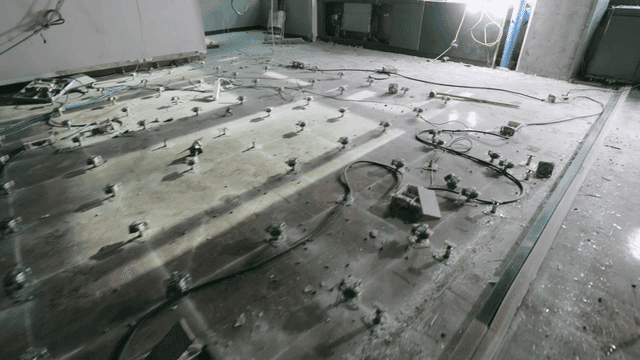 Floor of empty office under construction with cables