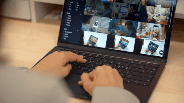 Person typing on a laptop in an office