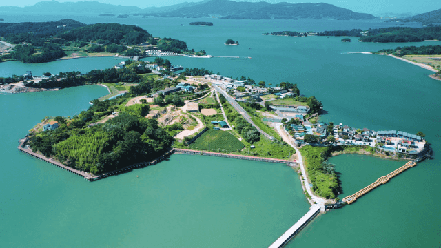A scenic island surrounded by blue waters