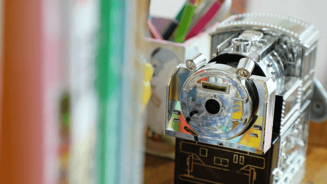 Books and toy train pencil sharpener on desk