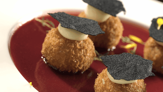 Croquettes topped with cream and truffle