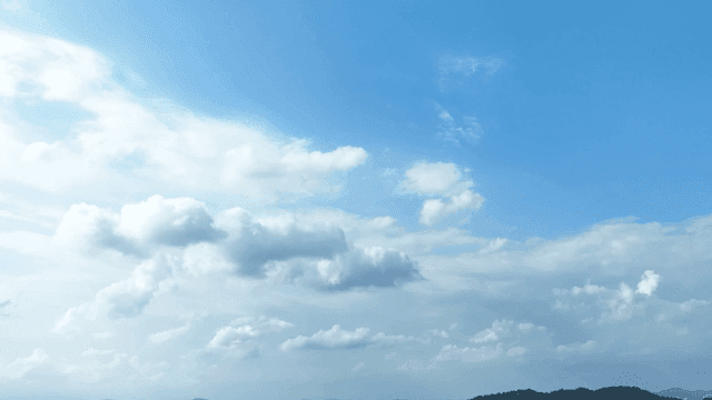 Blue sky and fluffy clouds