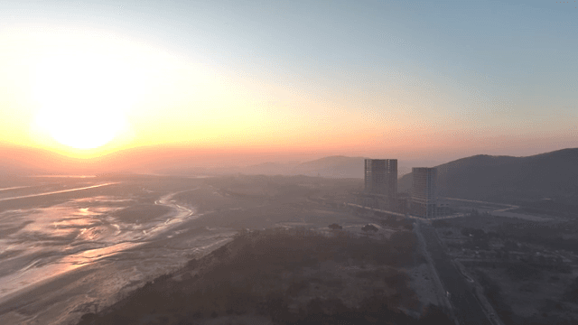 해안 풍경 위로 지는 해