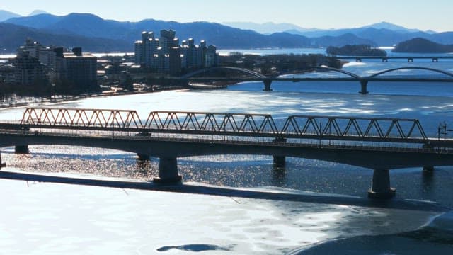 Cold Winter Day Overlooking Icy River and Bridges