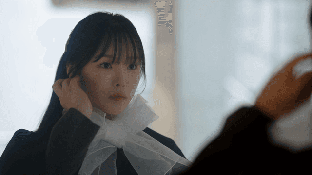 Female graduate fixing her hair