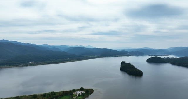 Vast river with surrounding mountains