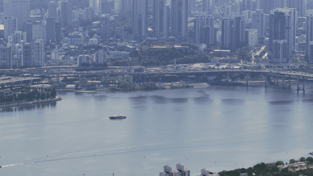 City skyline with river and boats