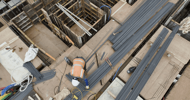 Construction site with workers and materials