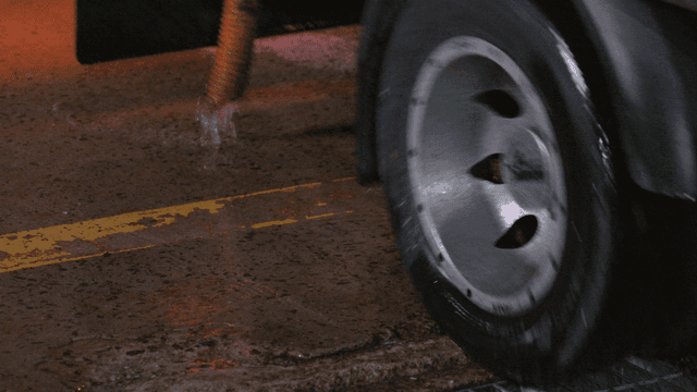 Water draining from a vehicle in a garage