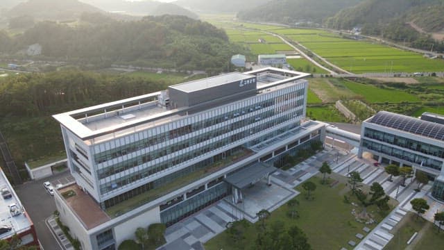 Modern building surrounded by lush greenery