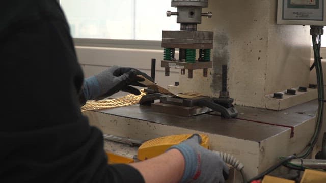 Metal stamping process in a factory