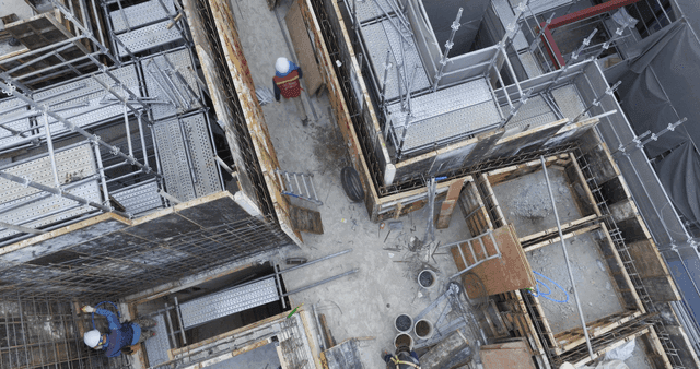 Construction site with workers in helmets