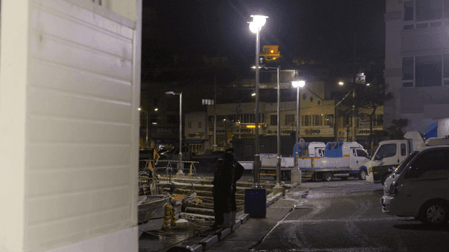 People smoking at night dock