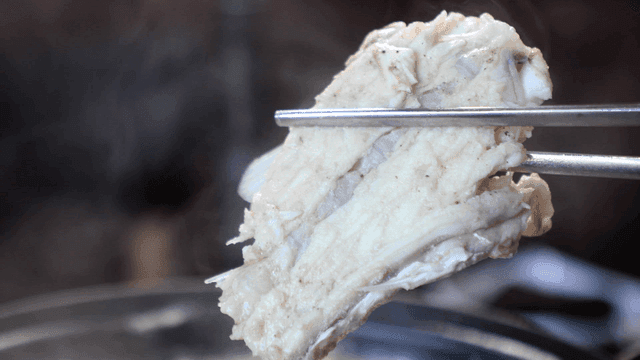 Boiling fish soup with chopsticks