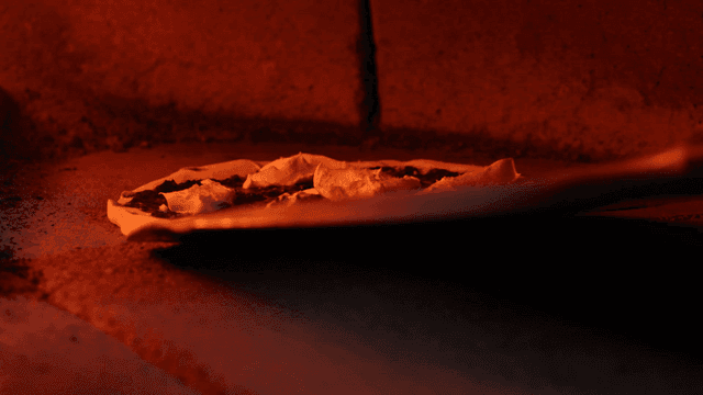 Pizza dough placed in oven