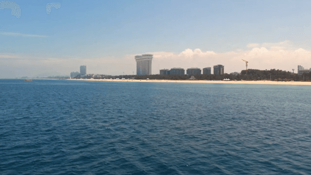 Coastal city skyline with clear blue sea