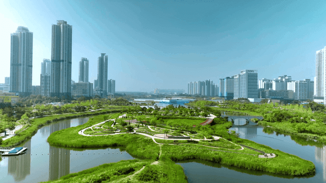 Modern city lake park scenery with lush greenery