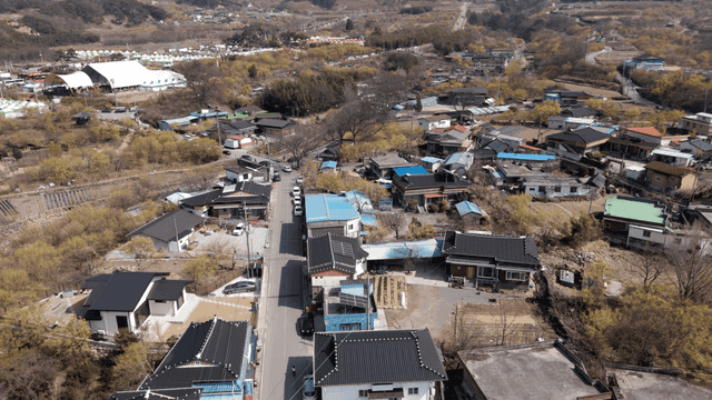 Peaceful rural village with road in middle