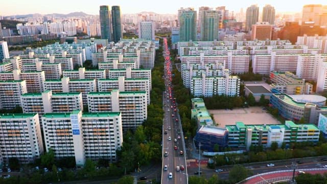 Bustling City Dusk with Dense Apartments and Buildings