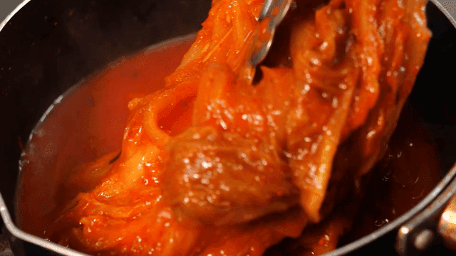 Kimchi stew boiling in a pot