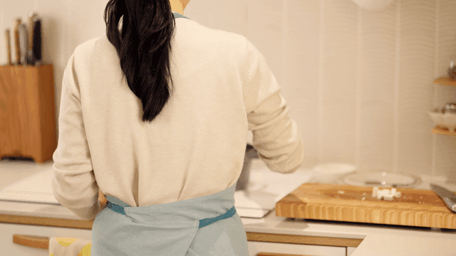 Person cooking in kitchen at home