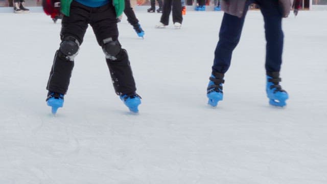 People ice skating on a rink