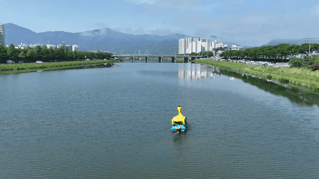 Colorful duck boats on calm river