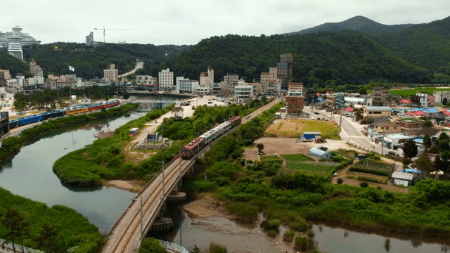 Coastal town with a train passing by