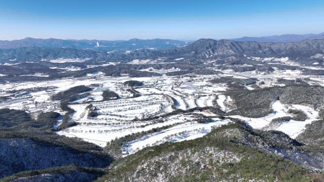 Snow-covered Landscape with Mountains and Trees