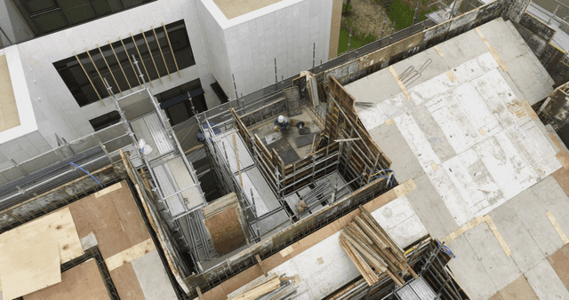 Construction site with scaffolding and workers