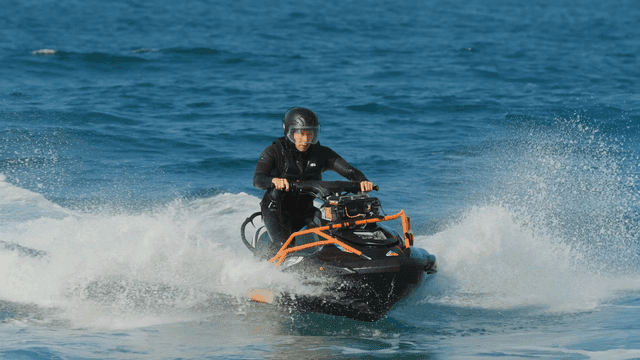 Person riding a jet ski on the ocean