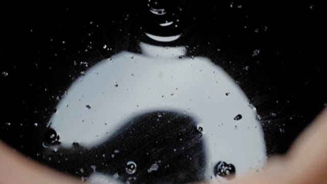 Pouring Soy Sauce into a Earthenware